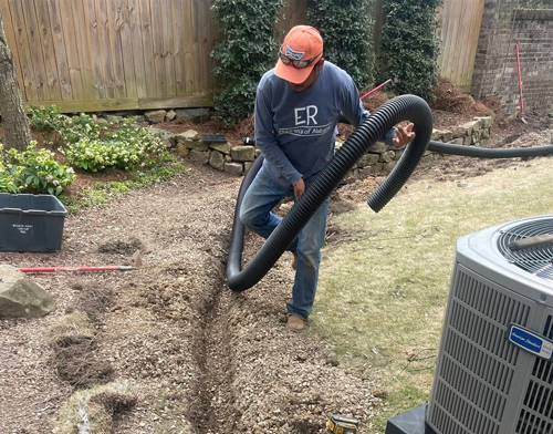 Drainage system installation with French drain pipe