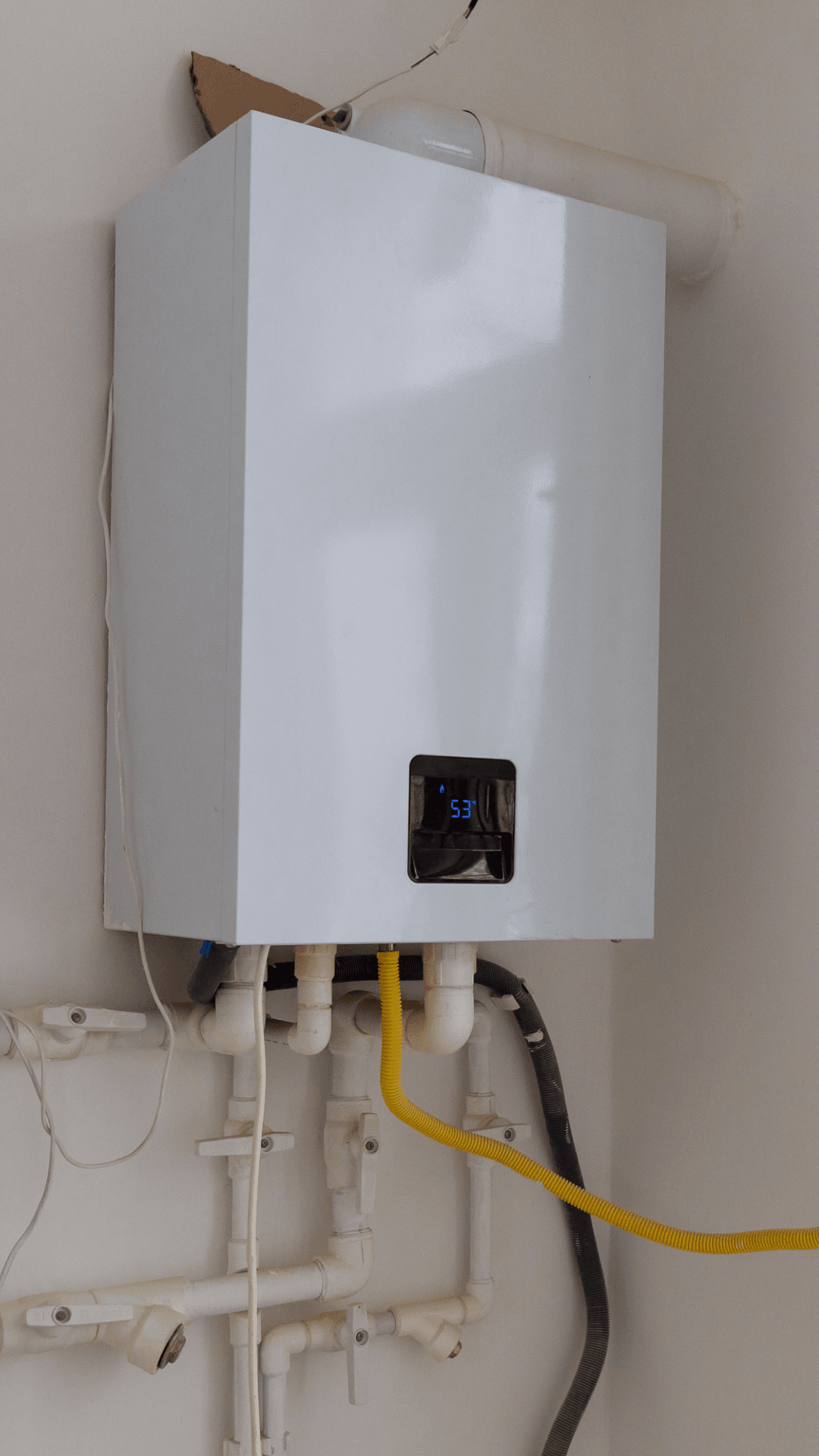 Close-up of boiler controls and pipework installed by Aphex Heating