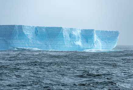 Large tabular iceberg in the Drake Passage on a sunny day. 