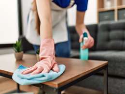 Woman Wiping Coffee Table