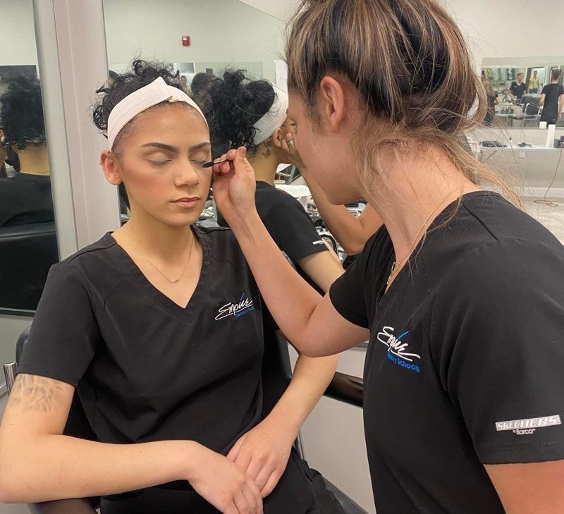 Student applying makeup