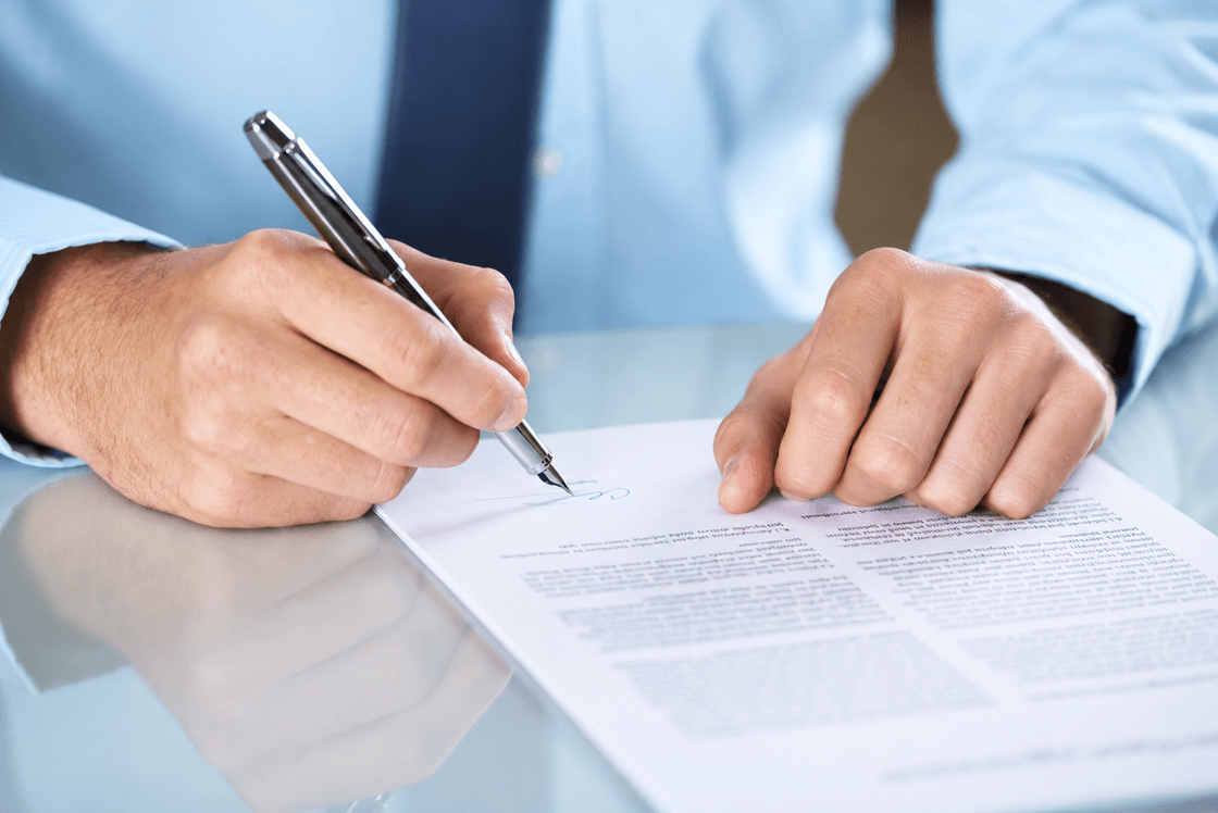 Professional signing an insurance claim document