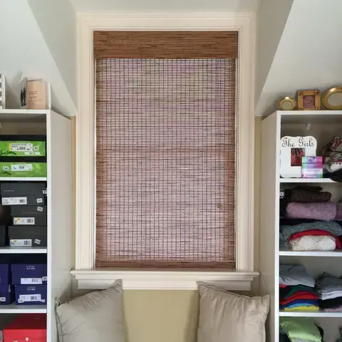 Woven wood shade on a window seat