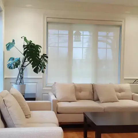 Solar roller shade in a living room
