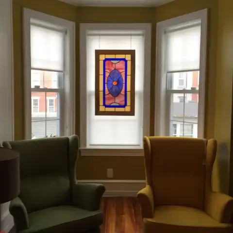 Roller shades in a bay window