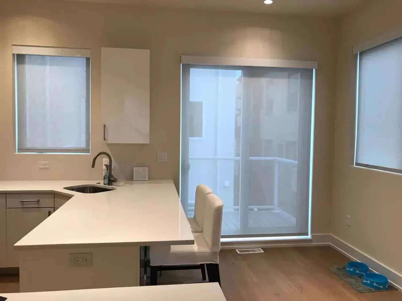 Roller shades in a kitchen and on a sliding door
