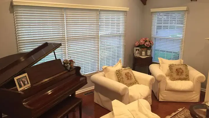 White wood blinds with valances in a living room