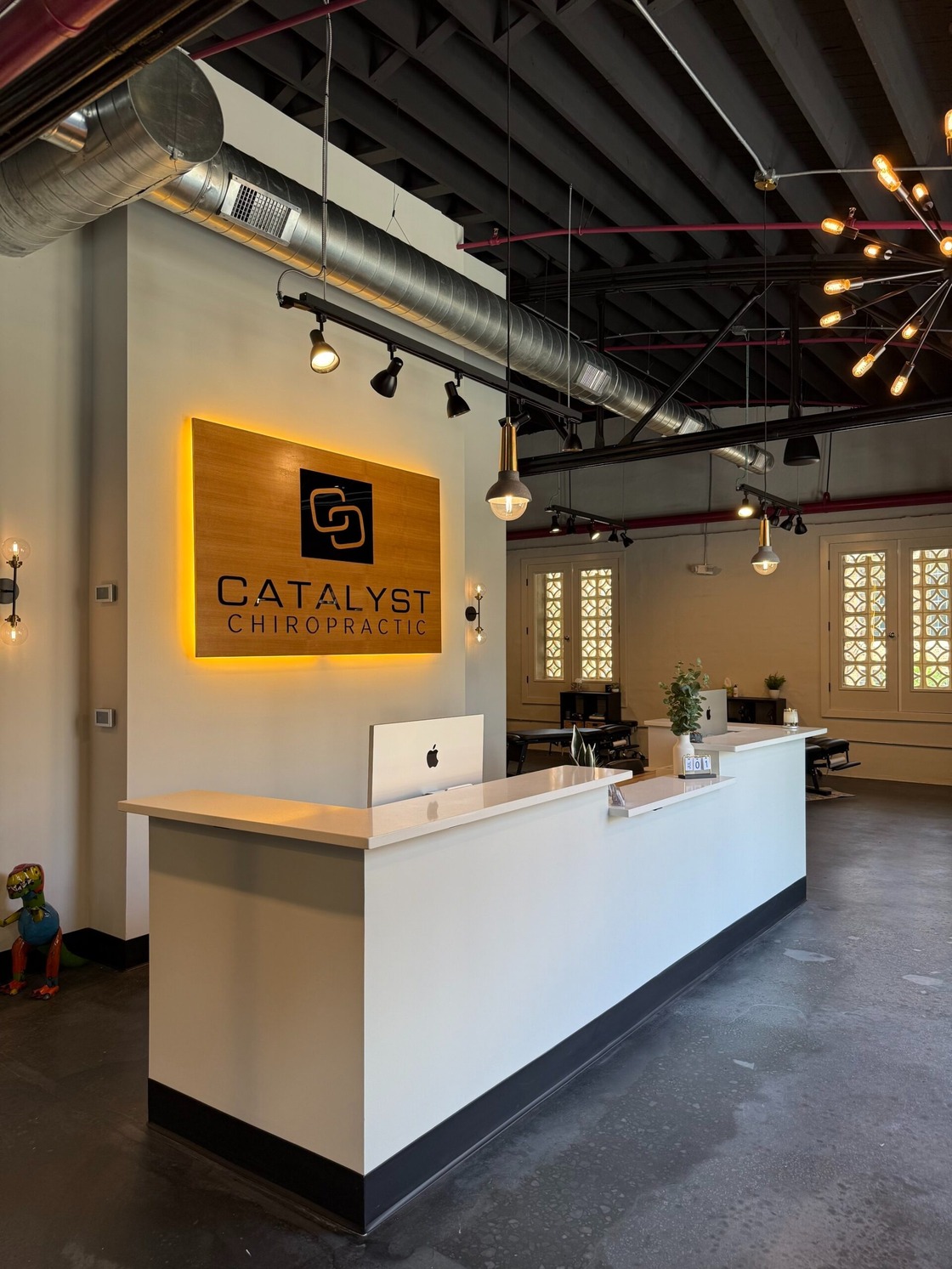 Catalyst Chiropractic team caring for a client in Charlotte