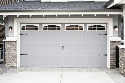 Grey garage door with windows at the top