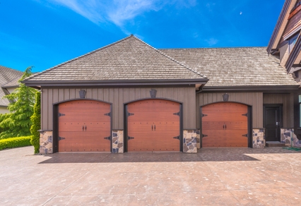 Brown wood triple garage doors