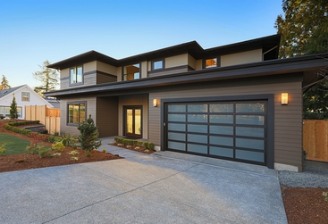 Two white barn door garage doors