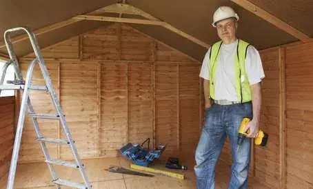 Technician ready to clean an attic space