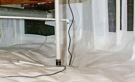 Crawl space with a vapor barrier and sump pump