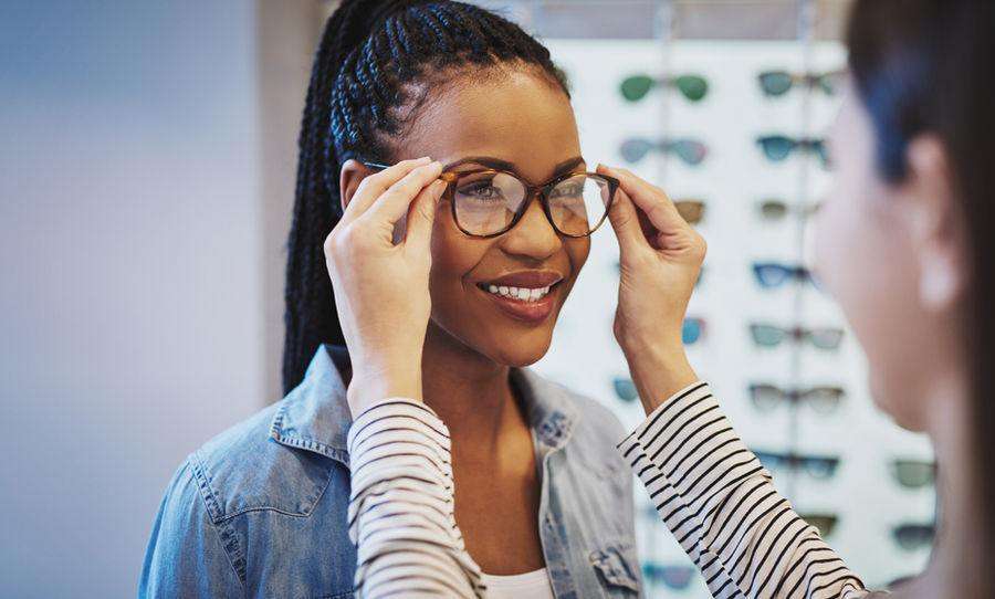 Woman trying on new eyeglass frames