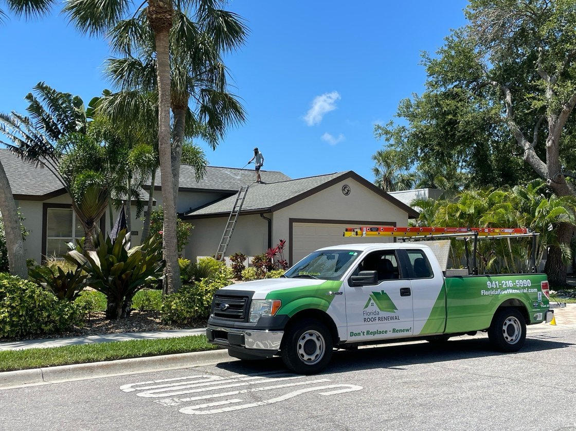 Florida Roof Renewal truck and equipment on a jobsite