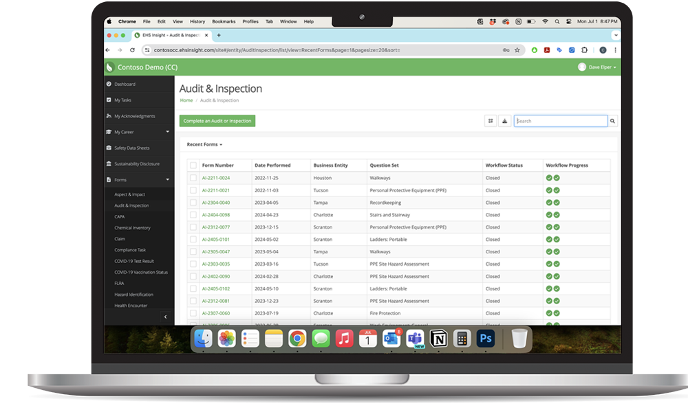 EHS Insight audit and inspection module on a laptop showing PPE, walkway, ladder, and fire protection inspections by site