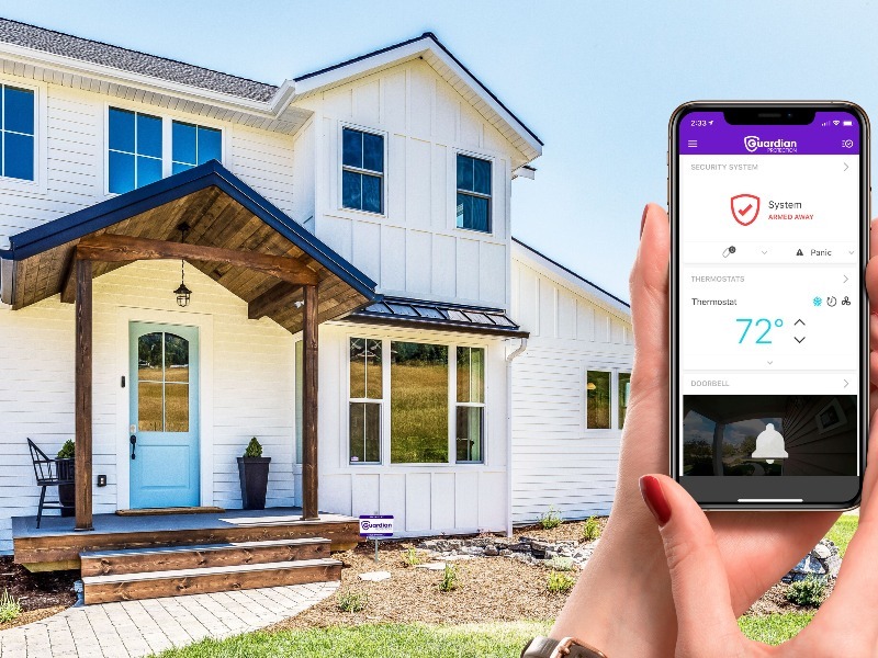 Home with image of Guardian Protection's app for home security
