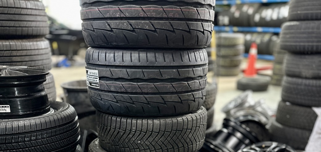 Neatly stacked tires at Green Tires