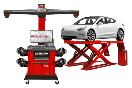 Tesla beside Hunter wheel-alignment equipment at Green Tires