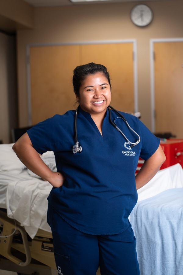 Gurnick Academy vocational nursing student standing in a clinical skills lab