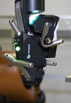 A close up of a CNC machine machinig a gear
