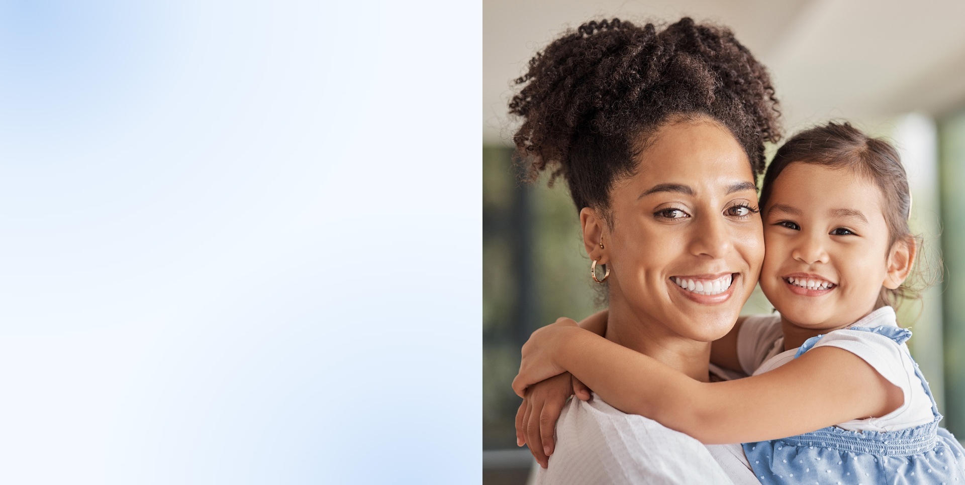 A smiling mother and daughter