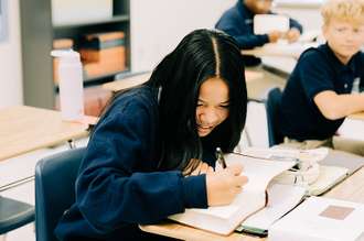 Image of high school students listening to a lesson