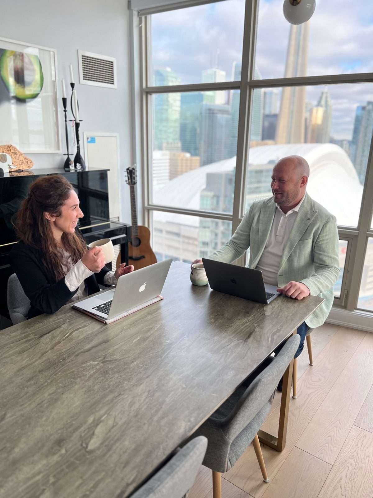 Nathan Dautovich meeting with a member of his team in downtown Toronto