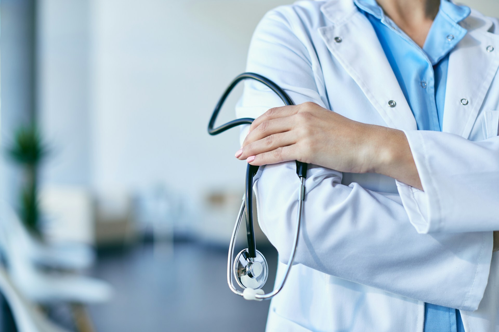 female doctor holding stethoscope