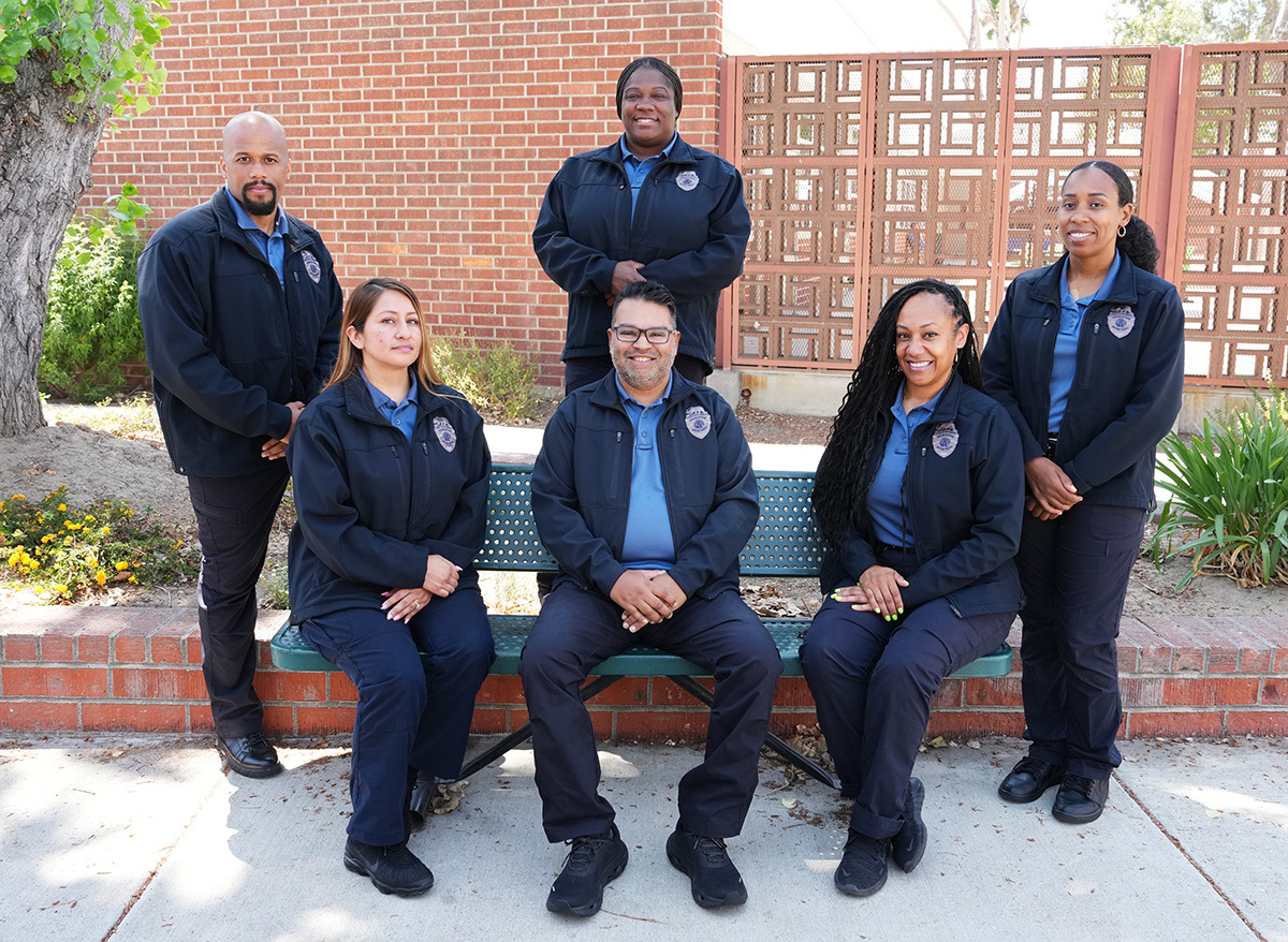 Six Deputy Probation Officers around a bench