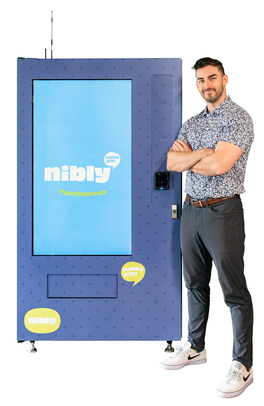 Nibly Snacks Vending Machine with Vending Machine Operator standing to the right of their machine. Nibly Vending Machines are Digital machines with modern tap-to-pay technology.