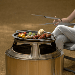 https://d9hhrg4mnvzow.cloudfront.net/offer.solostove.com/fire-pit-cooking-system/f3003fd4-cook-tops-lifestyle-60-1_108w08w000000000000028.png