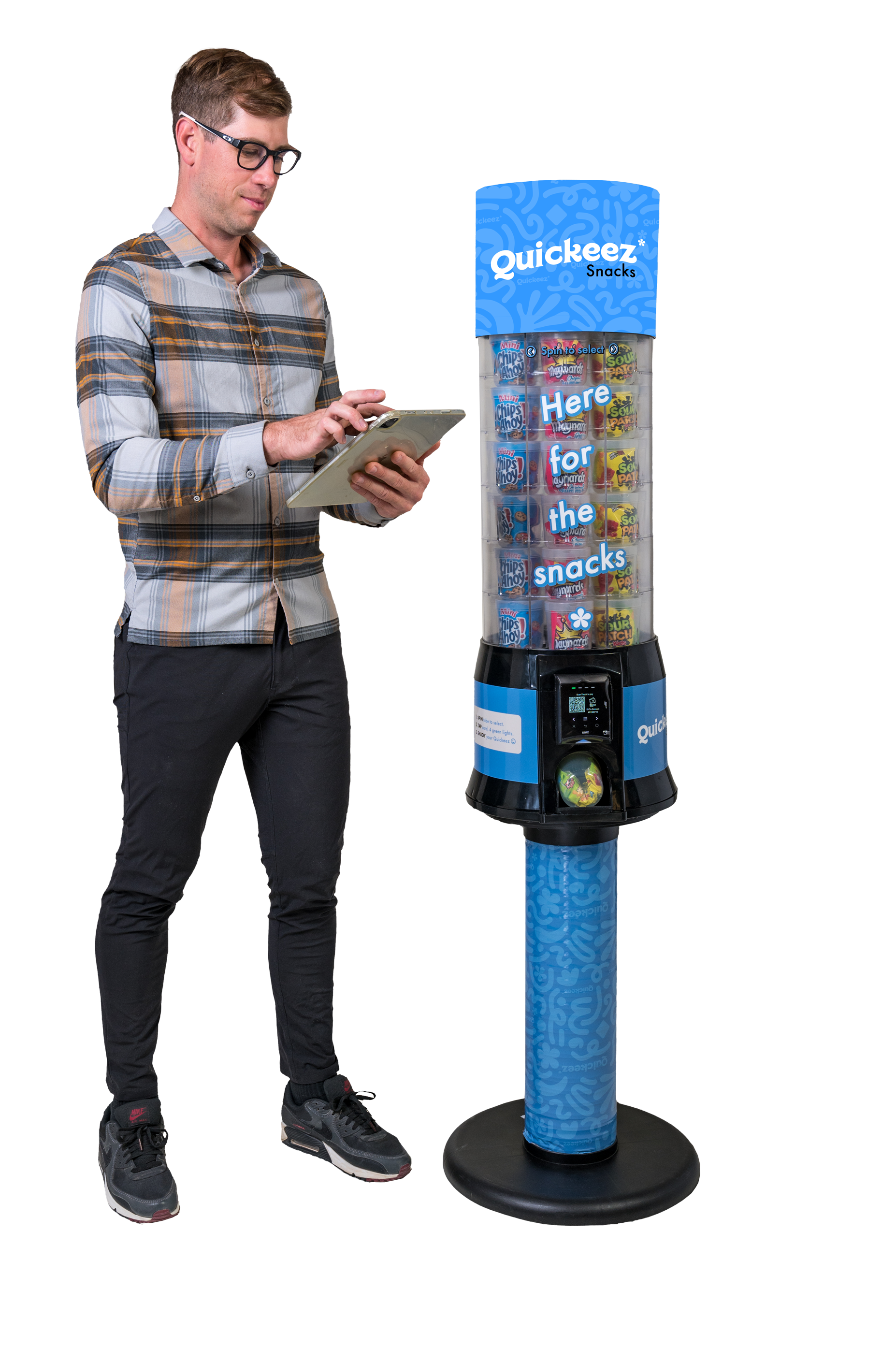 Quickeez Healthy Snacks Vending Machine, in use by Quickeez Snacks Vending operator. Vending Machine is next to operator on floor, filled with quick and convenient snacks.