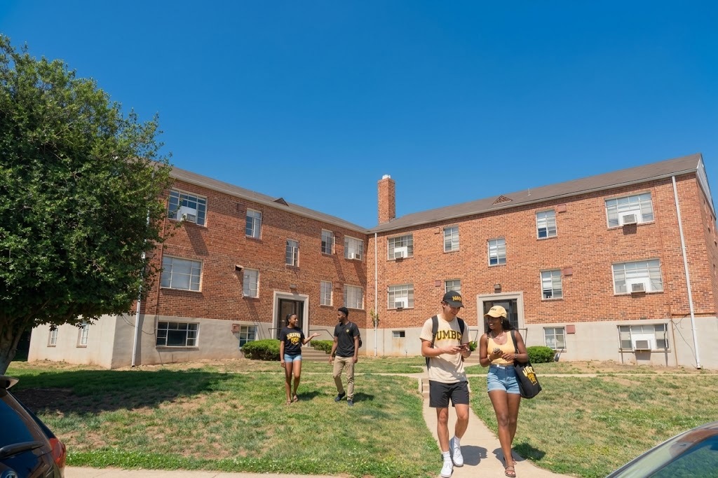 Residents walking outside Meadow Lane Apartments