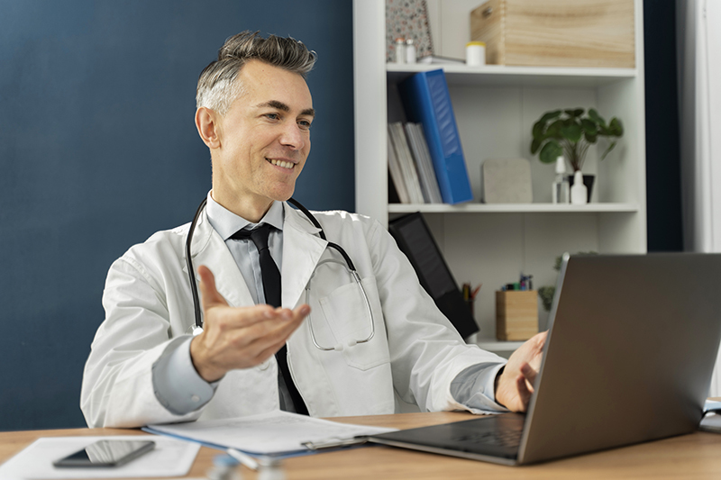 Healthcare provider consulting on a laptop