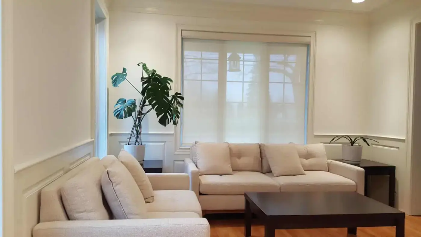 Solar roller shade in a living room