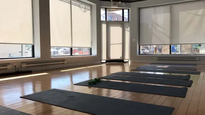 Roller shades in a fitness studio storefront