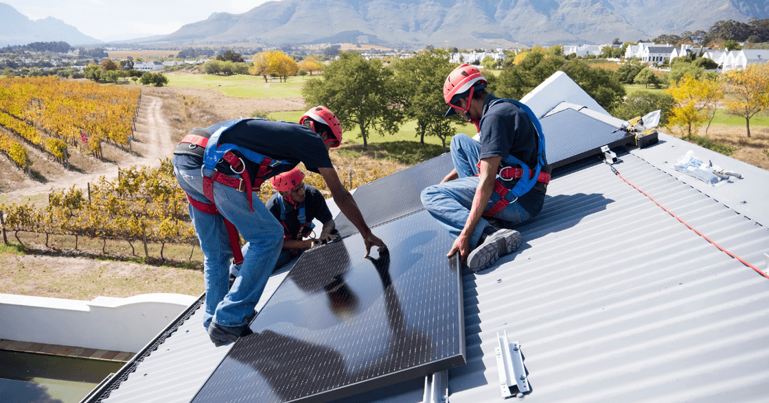 Technician installing solar panels