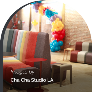 Meeting area with couches and balloons visible in the background.