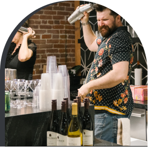 Bartender shaking mixed drink at event space