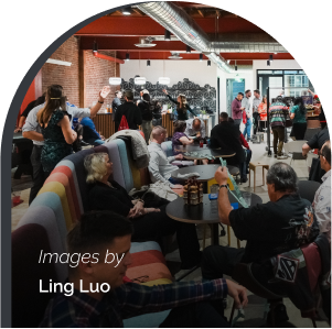Busy common area with multiple amounts of people sitting and conversing together.