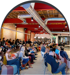 Large event gathering with people listening intently