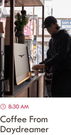 Man pouring himself a coffee at Daydreamer, in a beautiful cafe-style room.