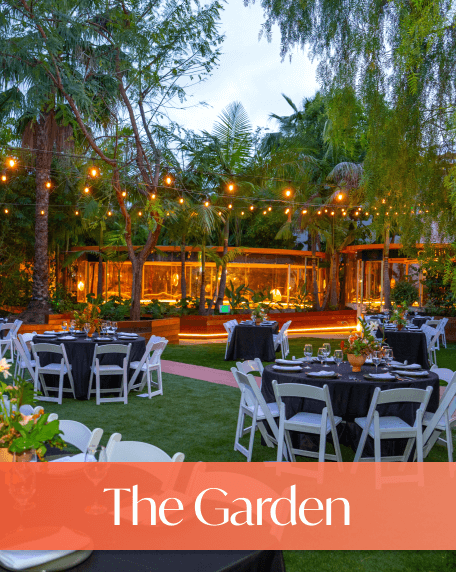 Garden area with abundant open greenspace, seats and tables surround.