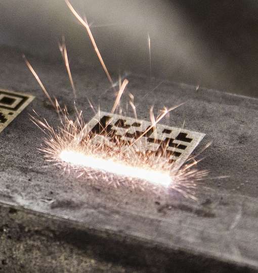 Laser-engraved traceability barcode on a metal part
