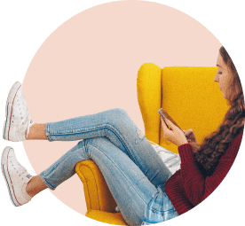 woman answering quiz on mobile phone while sitting on a chair