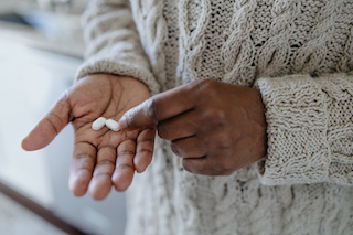 person holding medication