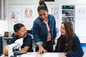 Teacher working with students