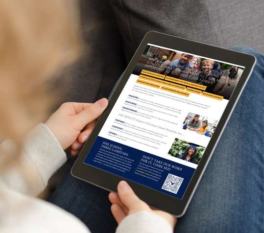 Image of woman holding an iPad and reading the Parent Info Packet.