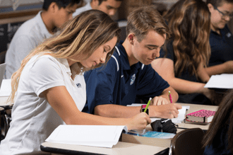 An image of high school students working at their desks.